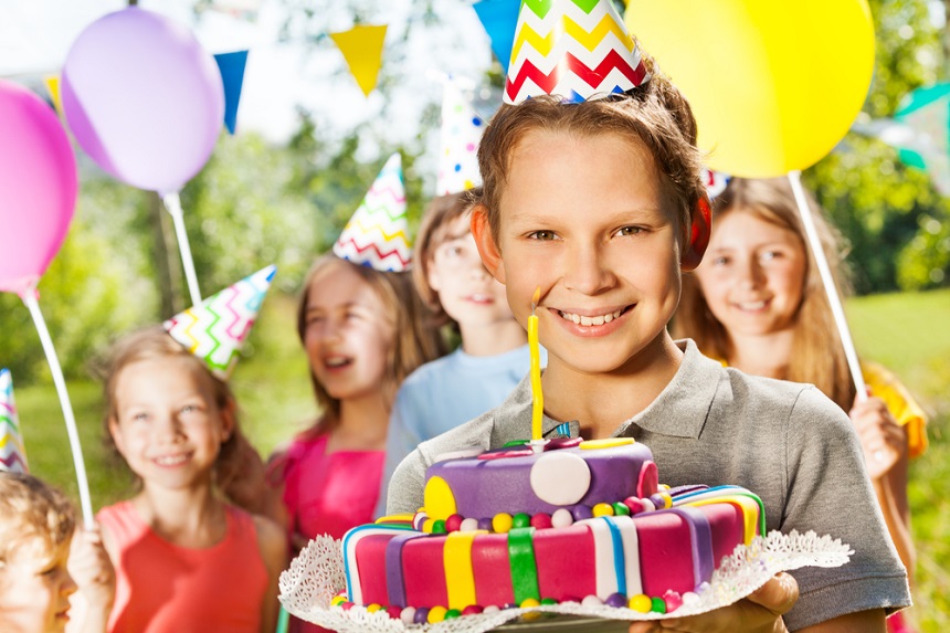 Отметить впервые. Children holding Gifts at an Outdoor Party.